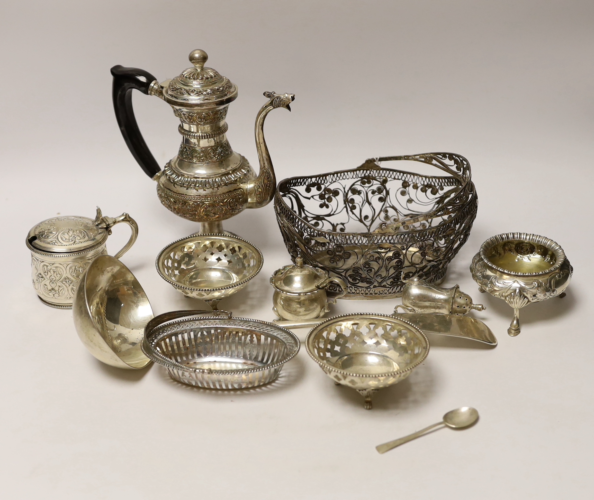 A quantity of silver and white metal items including a continental filigree basket, small silver bonbon dish, George III soup ladle, salts, Victorian silver mustard, etc.